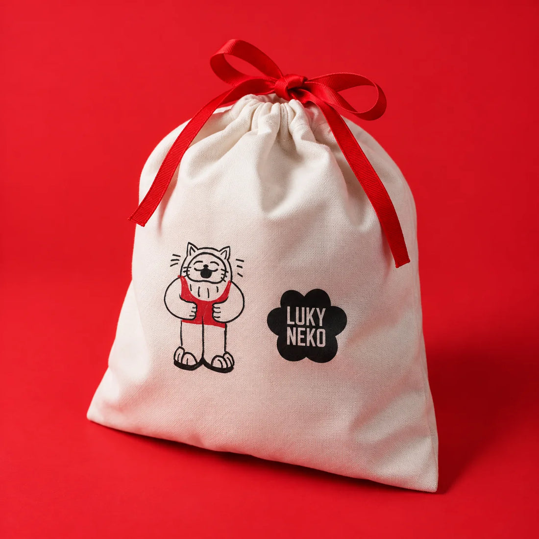 Lucky Bag 2027 cotton bag closed with a red ribbon, ready to gift